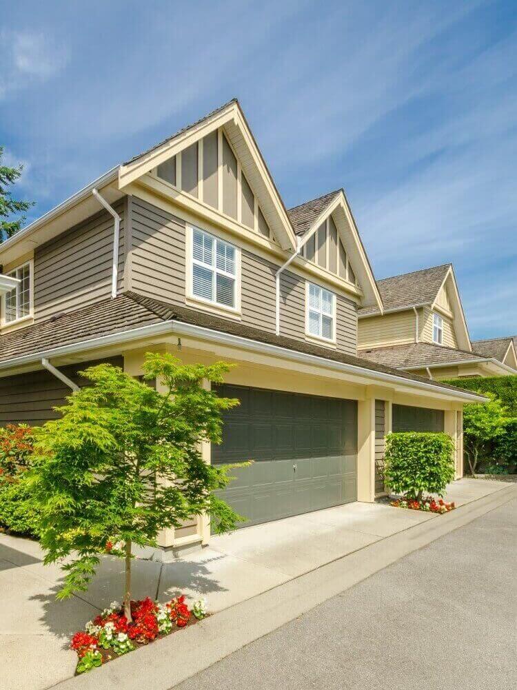 Beautiful home with garage and shrubs
